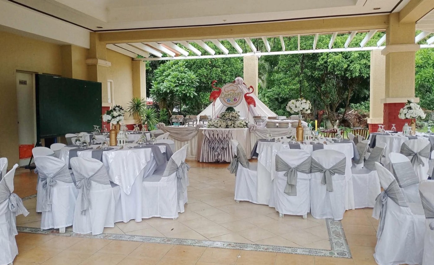 A real Lariosa's Catering reception hall setup with the signature flamingo buffet